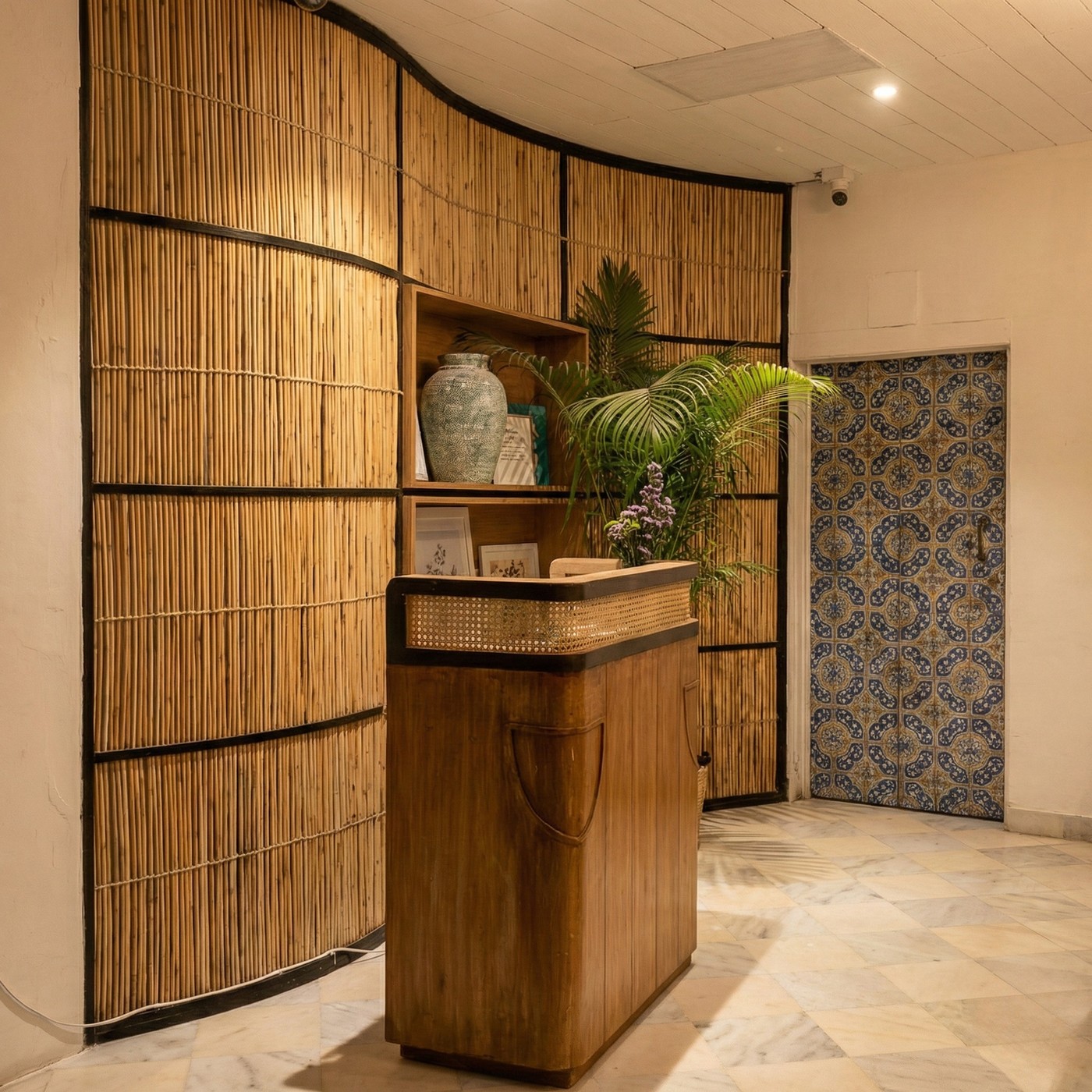 Curved bamboo woven partition in a hospitality reception